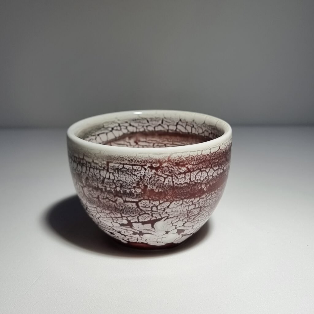 Handmade crackle glaze ceramic matcha bowl in burgundy and cream