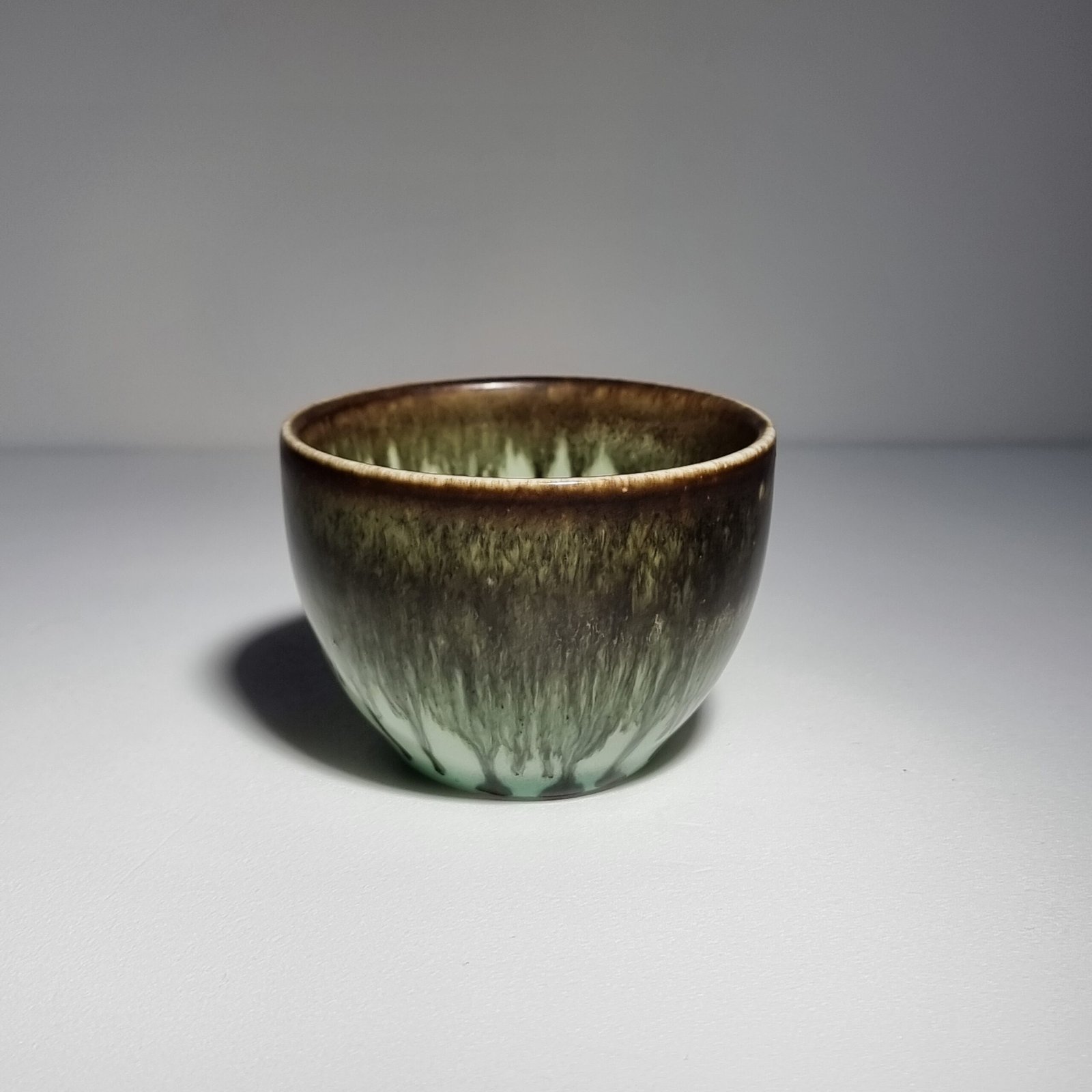 Handmade olive drip glaze teacup with celadon interior